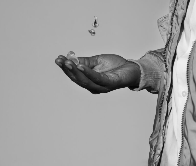 Man holding earplugs in hand