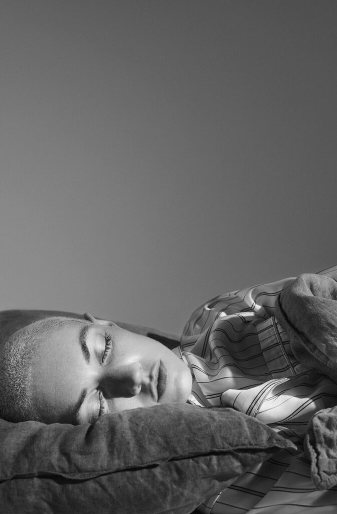 Female sleeping with earplugs