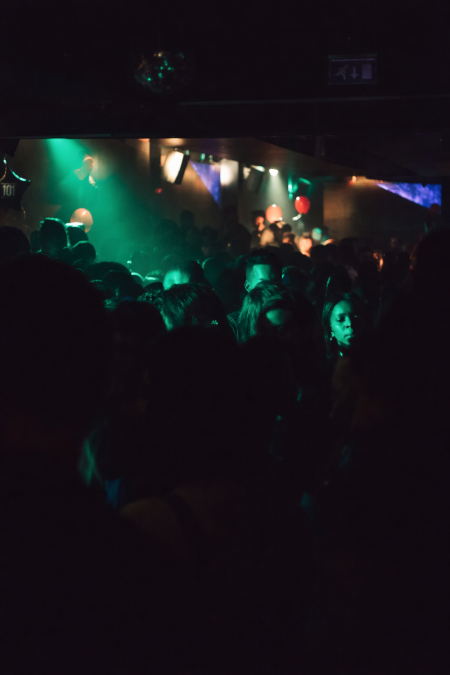 People dancing with Happy Eras earplugs